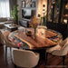 Elegant round epoxy dining table styled interior with warm natural ambiance