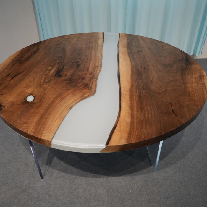 Round smoky gray epoxy dining table with natural walnut grain