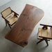 Rustic black walnut live edge table with irregular shape and rich walnut grain