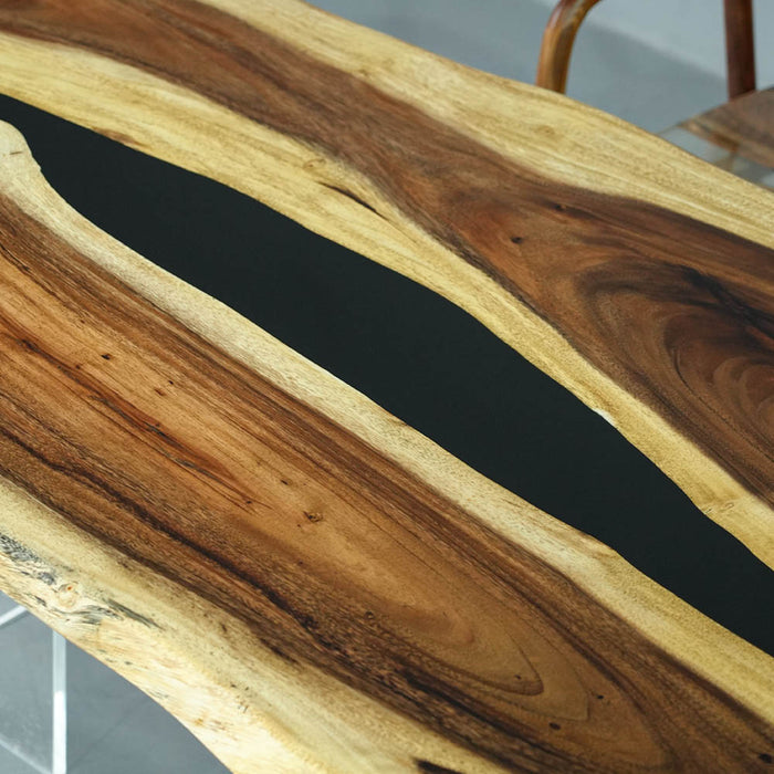 Wooden table with black resin inlay