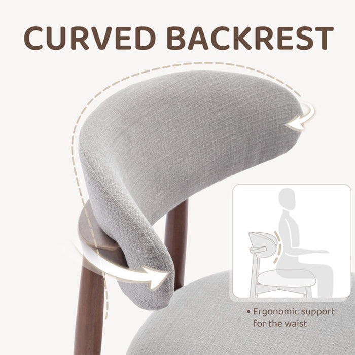 Gray cushion with curved backrest on a chair, highlighting ergonomic support.