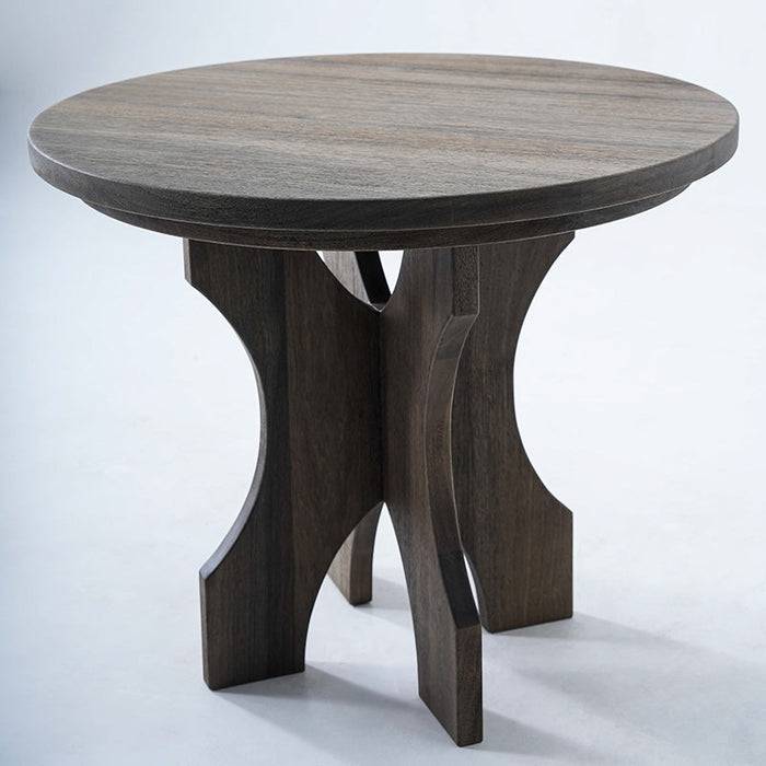 Small round table with sculpted Terminalia wood base and smooth surface