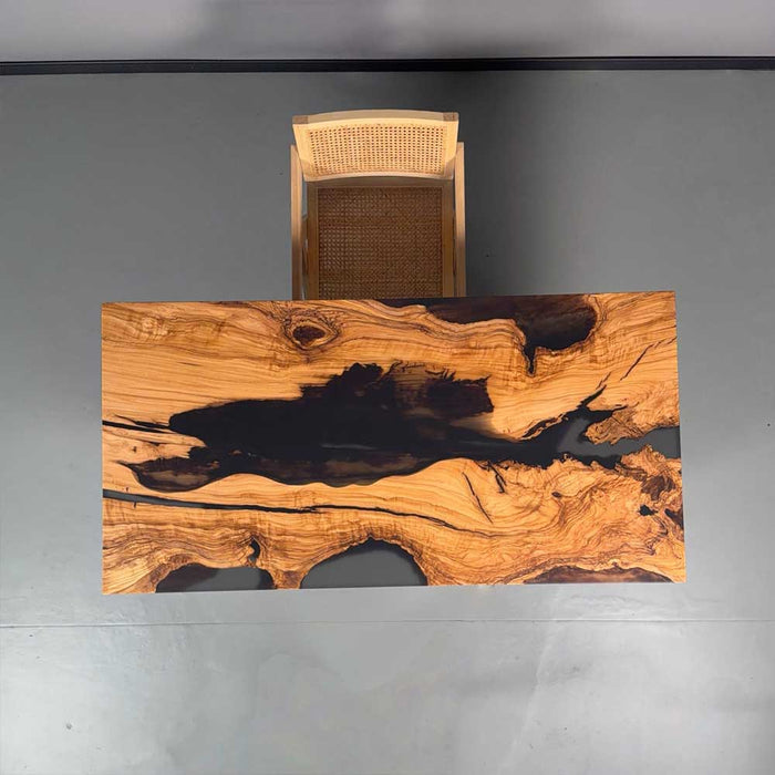 Wooden desk with a unique grain pattern on a gray background