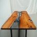 Modern black walnut epoxy dining table with natural wood grain