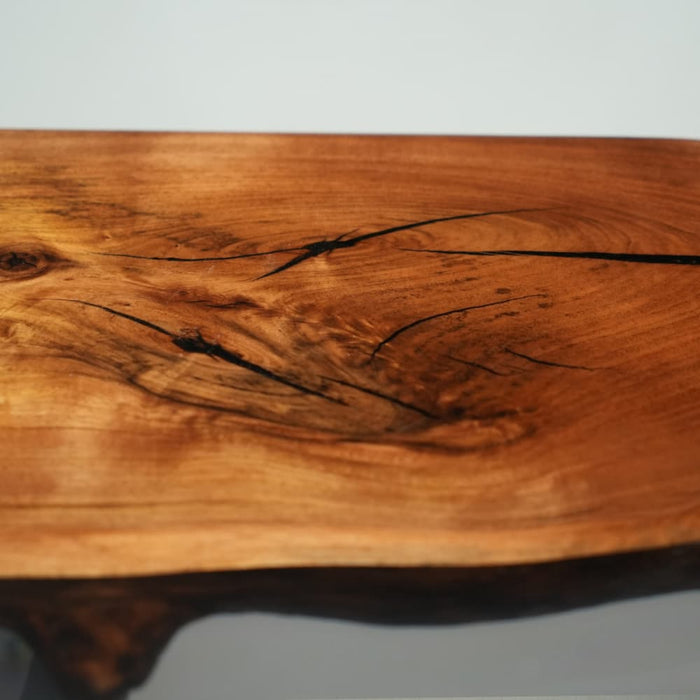 Solid walnut dining table featuring transparent epoxy resin