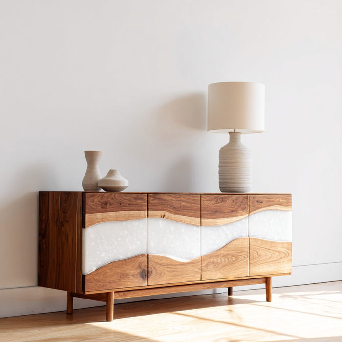 Wooden sideboard with white panels against a white wall