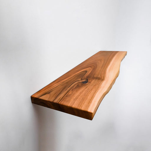 Wooden shelf against a white background