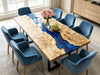 Poplar burl epoxy resin table featuring a stunning blue river design and durable black metal base