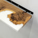 Wooden shelf with natural finish and black metal bracket on a white background