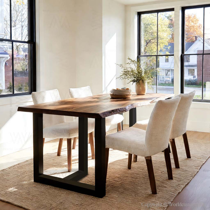 Dining room with a wooden table and white chairs near large windows.