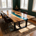Translucent blue epoxy dinning table placed in an open kitchen and dining space
