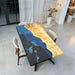 Contemporary poplar wood dining table with translucent deep blue resin and subtle black resin details, durable and stylish.