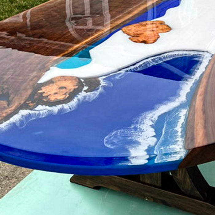 Unique black walnut conference table with smooth blue epoxy river in california