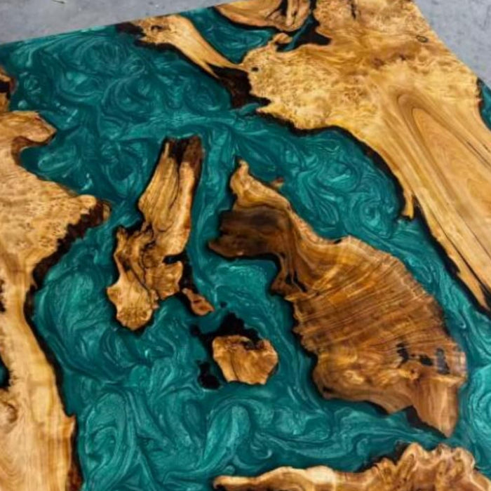 Unique burl resin dining room table with artistic green swirl pattern
