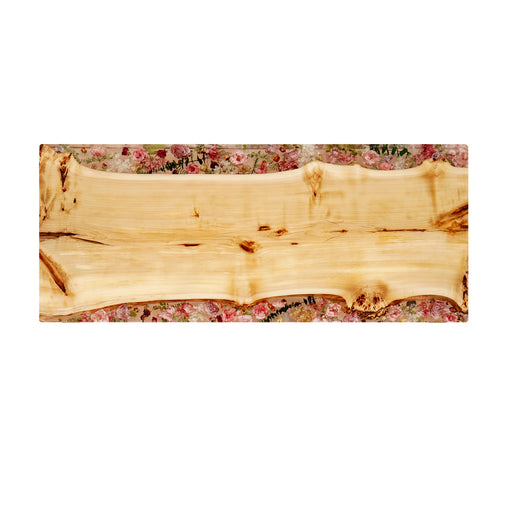 Wooden slab with a floral patterned background