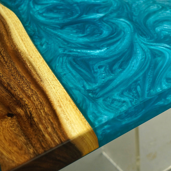 Close-up of a wooden surface with a blue resin finish