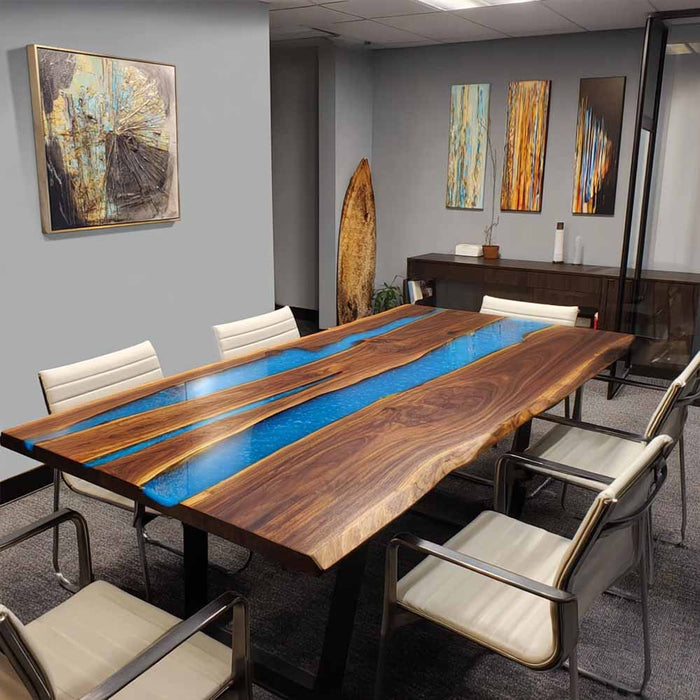 Modern conference room with a unique wooden table featuring a blue resin inlay.
