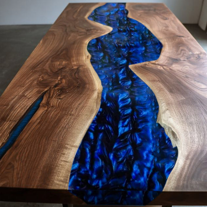 Wooden table with a blue resin river design