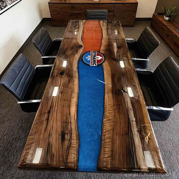 A black walnut ice and fire epoxy conference table placed in a luxury boardroom with modern executive seating.