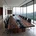 Bespoke black walnut conference table with handcrafted black resin river designed for luxury boardrooms and commercial interiors.