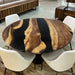 Round walnut and black epoxy coffee table in modern living room