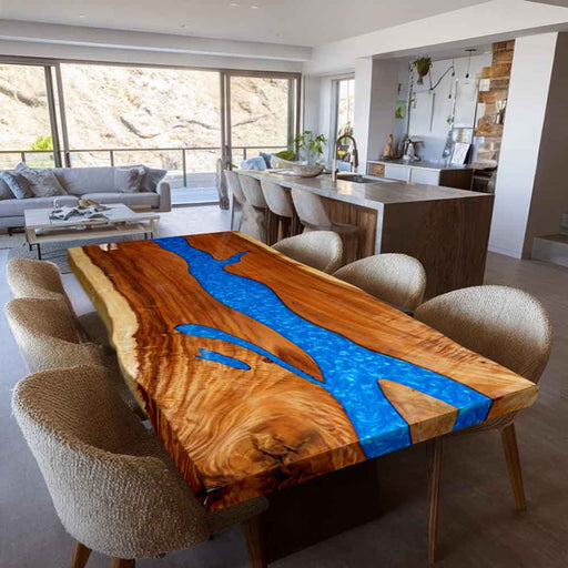 Dining table with blue resin inlay in a modern living room