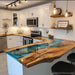 Close-up of live edge walnut wood and ocean blue epoxy resin bar top detail