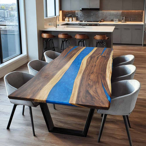 Dining table with blue resin inlay in a modern kitchen setting