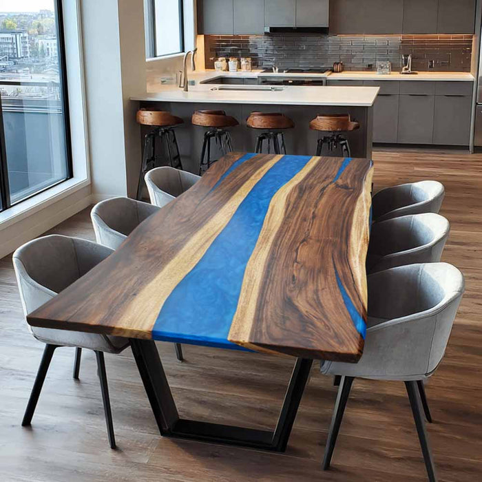 Dining table with blue resin inlay in a modern kitchen setting