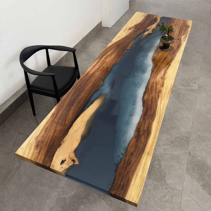 Wooden table with blue resin inlay in a modern interior setting