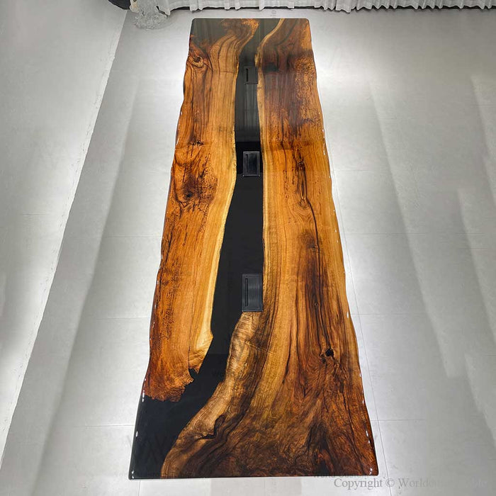 Wide angle view of walnut epoxy boardroom table in a luxury office