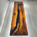 Wide angle view of walnut epoxy boardroom table in a luxury office