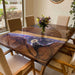 Walnut epoxy coffee table with floral resin centerpiece and LED lighting in a modern living room