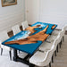 A modern walnut epoxy ocean table with realistic wave and beach design