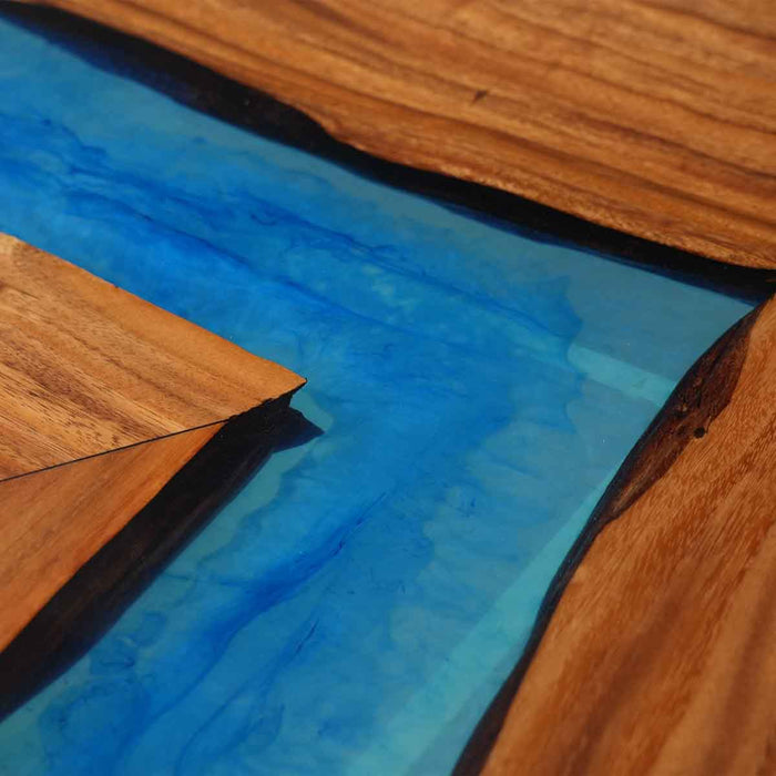 Walnut bar or kitchen countertop featuring mysterious blue epoxy resin river