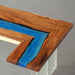 Walnut island countertop with mysterious blue epoxy resin river for kitchens