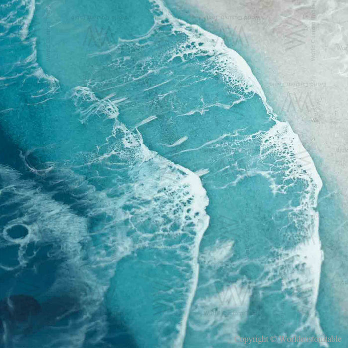 Handcrafted walnut river table with translucent blue ocean resin and detailed beach wave textures.