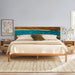 Wooden bed with a decorative headboard in a bedroom setting
