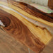 Close-up highlighting natural walnut texture and crystal-clear epoxy resin