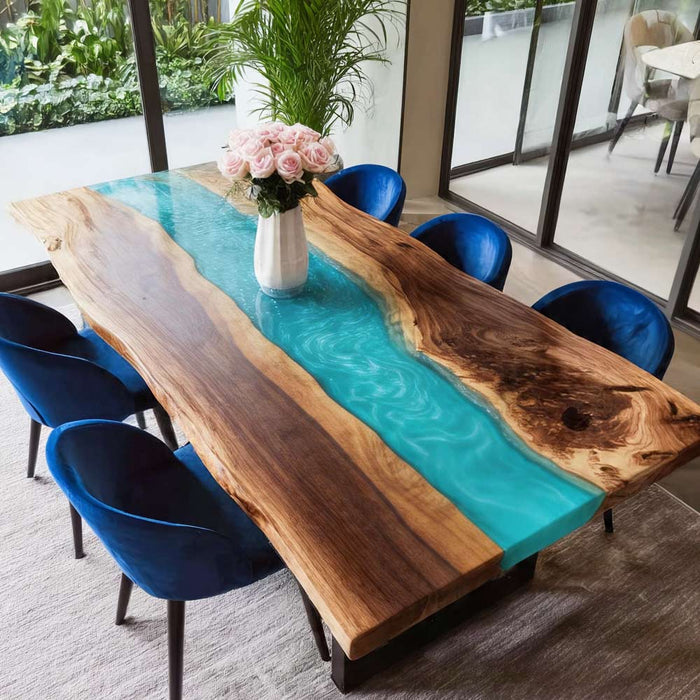 Walnut dining table with turquoise resin river in a bright California dining space.