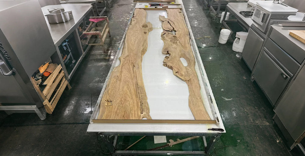 Large wooden slab on a metal platform in a kitchen setting