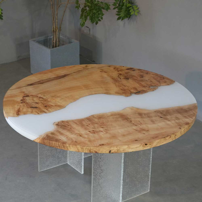 Round poplar wood table with elegant white epoxy river and smooth finish.