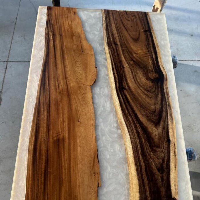 White epoxy river table with natural walnut grain