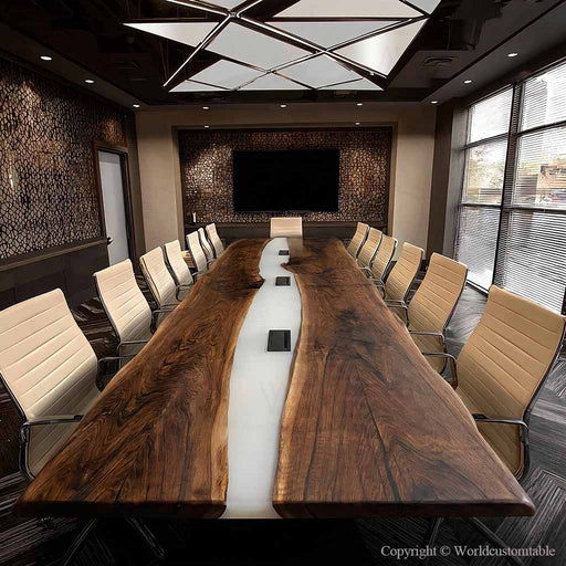 White resin river conference table featuring built-in power outlets for office use and device charging.