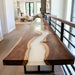 Close up of white resin river and walnut grain on console table