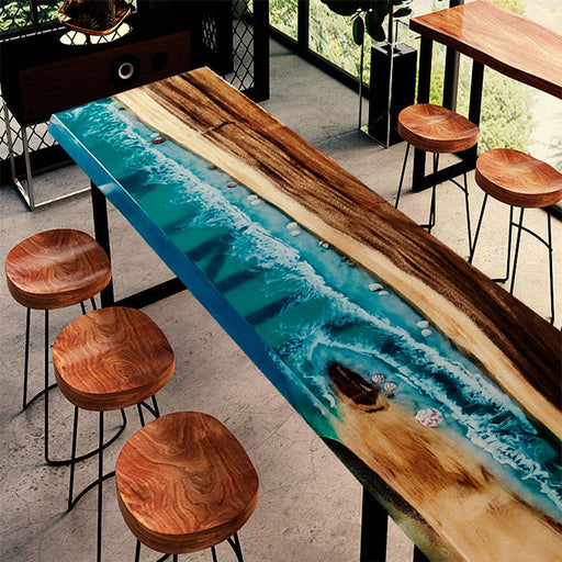 Handcrafted ocean-themed resin high table with wood base and stools, ideal for coastal homes or cafes.