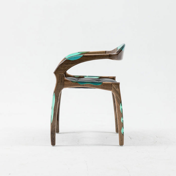 Wooden chair with teal accents on a white background